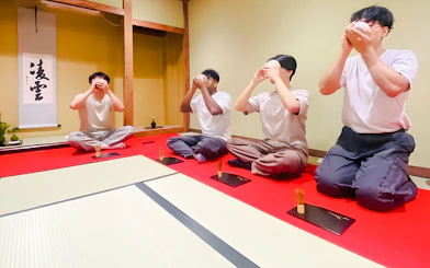 Men participating in a matcha tea ceremony in Osaka, Japan.