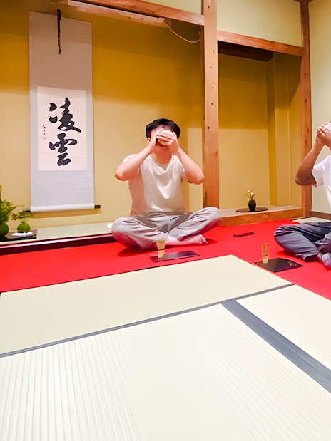 Men participating in a matcha tea ceremony in Osaka, Japan.