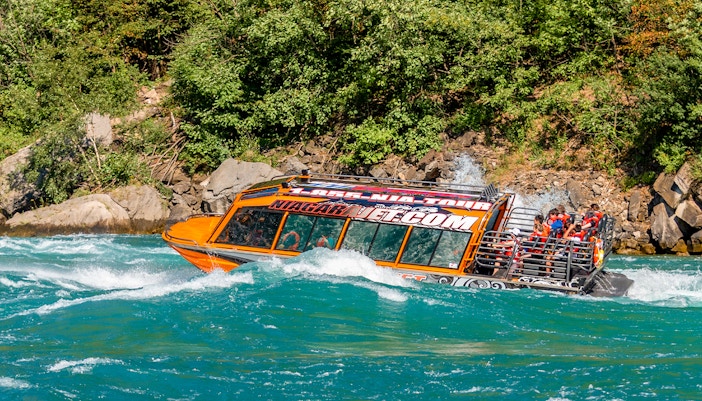 Niagara River jet boat navigating rapids near Niagara Falls.