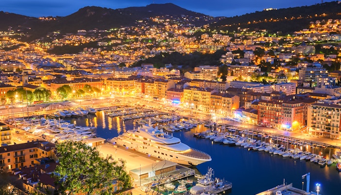 Villefranche-sur-Mer harbor illuminated at night during New Year in Nice.