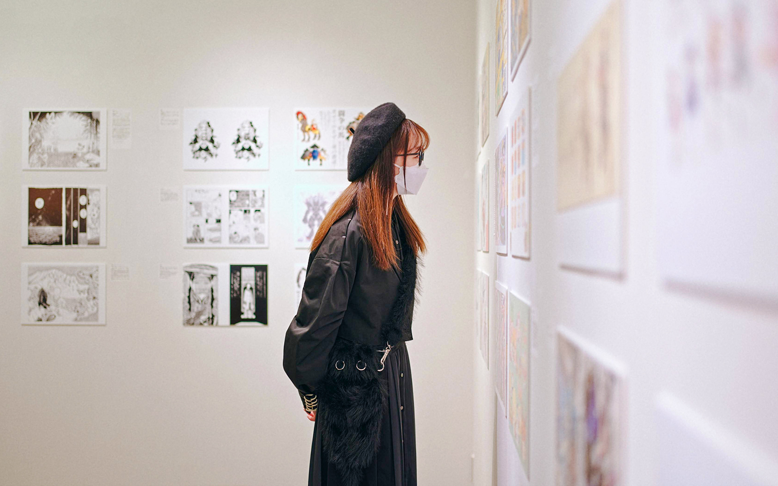 Woman viewing art exhibit in a Japanese museum.