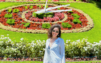 Flower Clock in Viña del Mar, Chile with colorful floral design in the background.