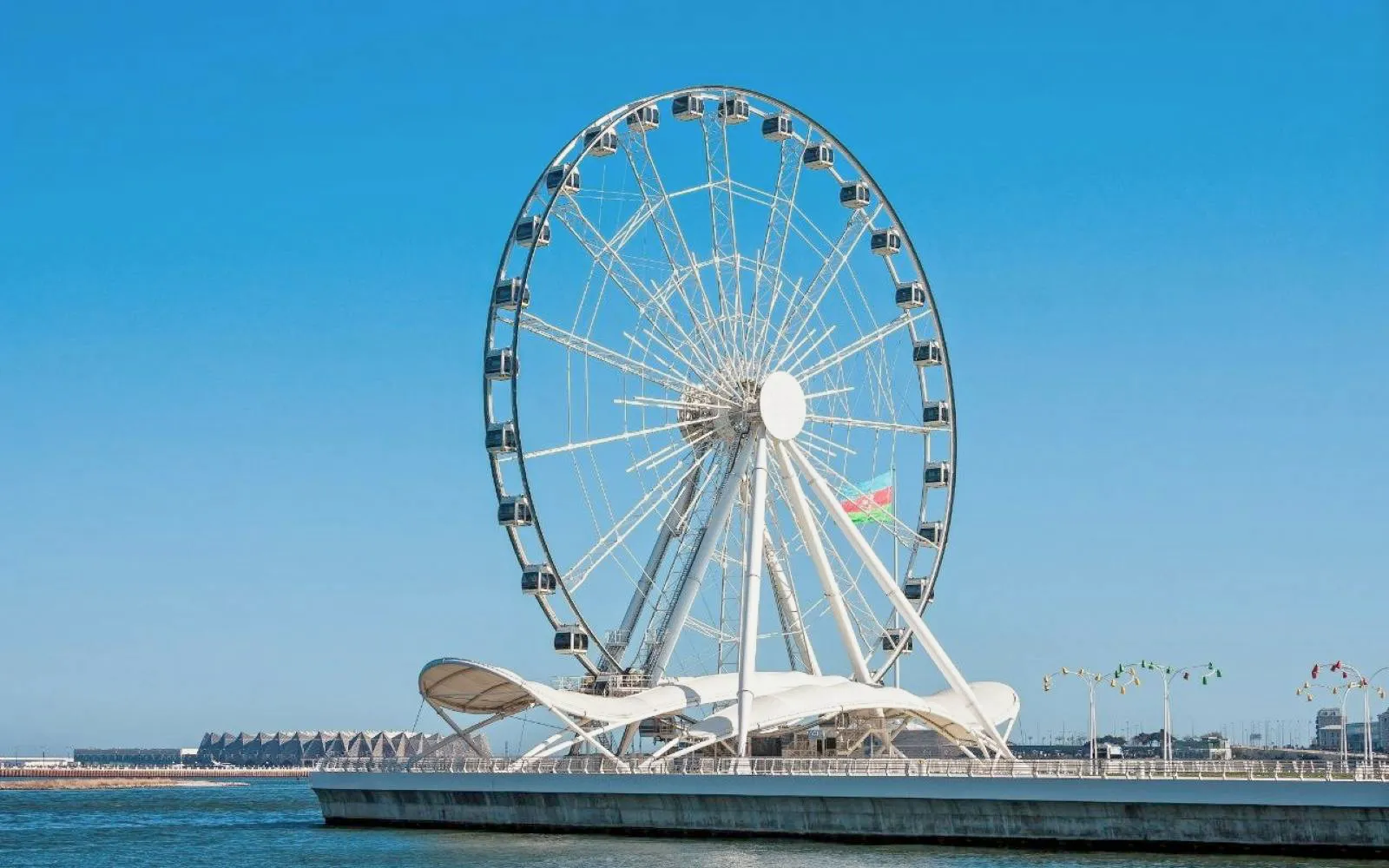 Ferris wheel on Baku Boulevard during guided walking tour of city highlights.