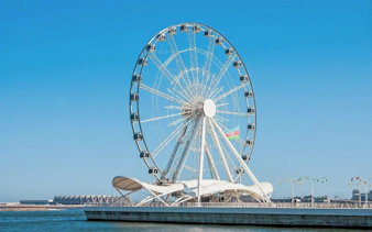 Ferris wheel on Baku Boulevard during guided walking tour of city highlights.