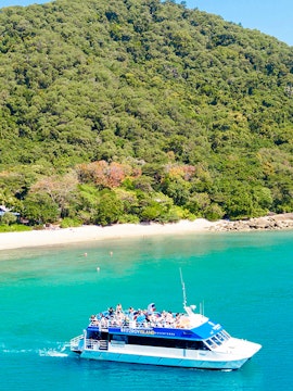 Fitzroy Island ferry approaching Cairns, Australia coast.
