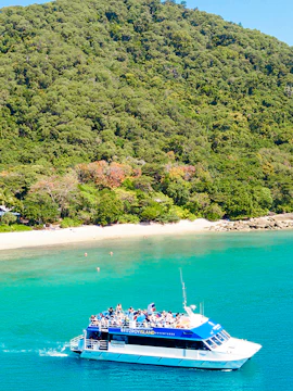 Fitzroy Island ferry approaching Cairns, Australia coast.