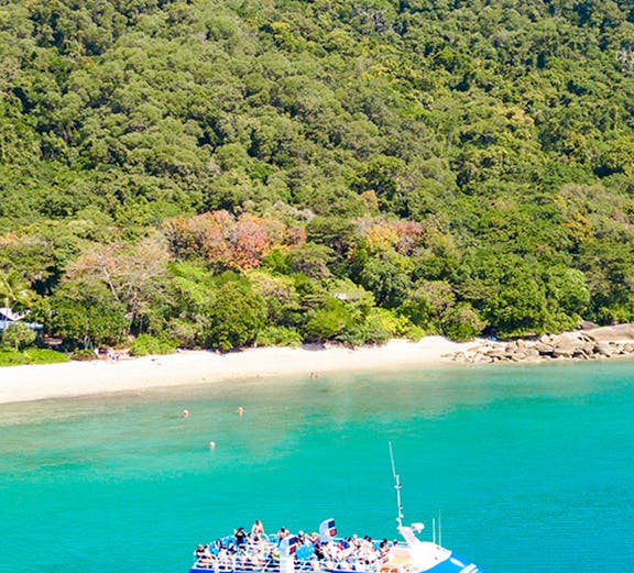 Fitzroy Island ferry approaching Cairns, Australia coast.