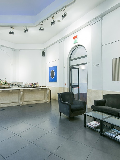 Opera concert venue lobby in Rome with seating and bar area.
