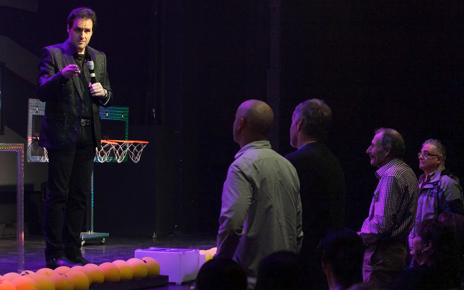 Performer engaging audience during The Mentalist show.