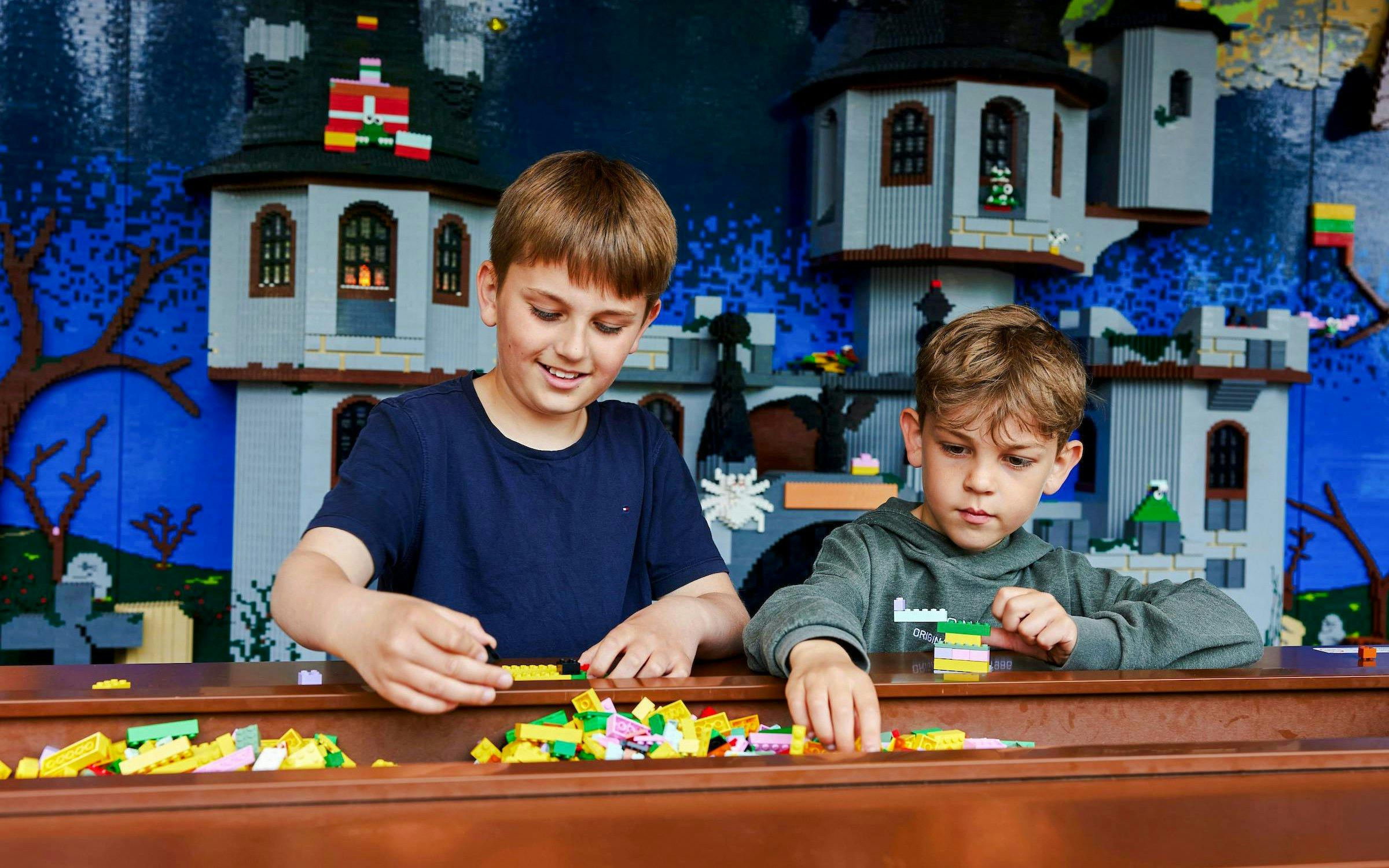 Children building with LEGO bricks at LEGOLAND® Billund.