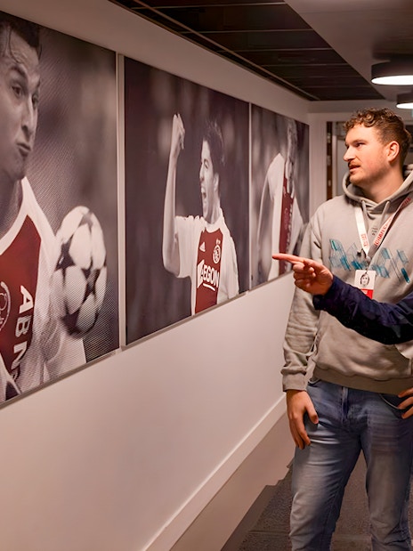 Visitors admire football memorabilia at Johan Cruijff ArenA Classic Tour.