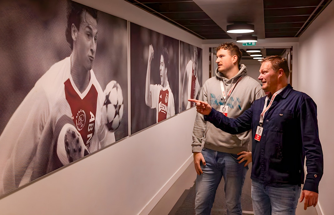 Visitors admire football memorabilia at Johan Cruijff ArenA Classic Tour.