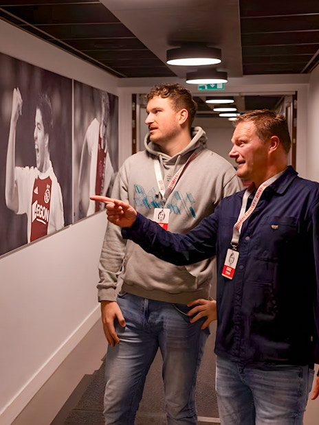 Visitors admire football memorabilia at Johan Cruijff ArenA Classic Tour.