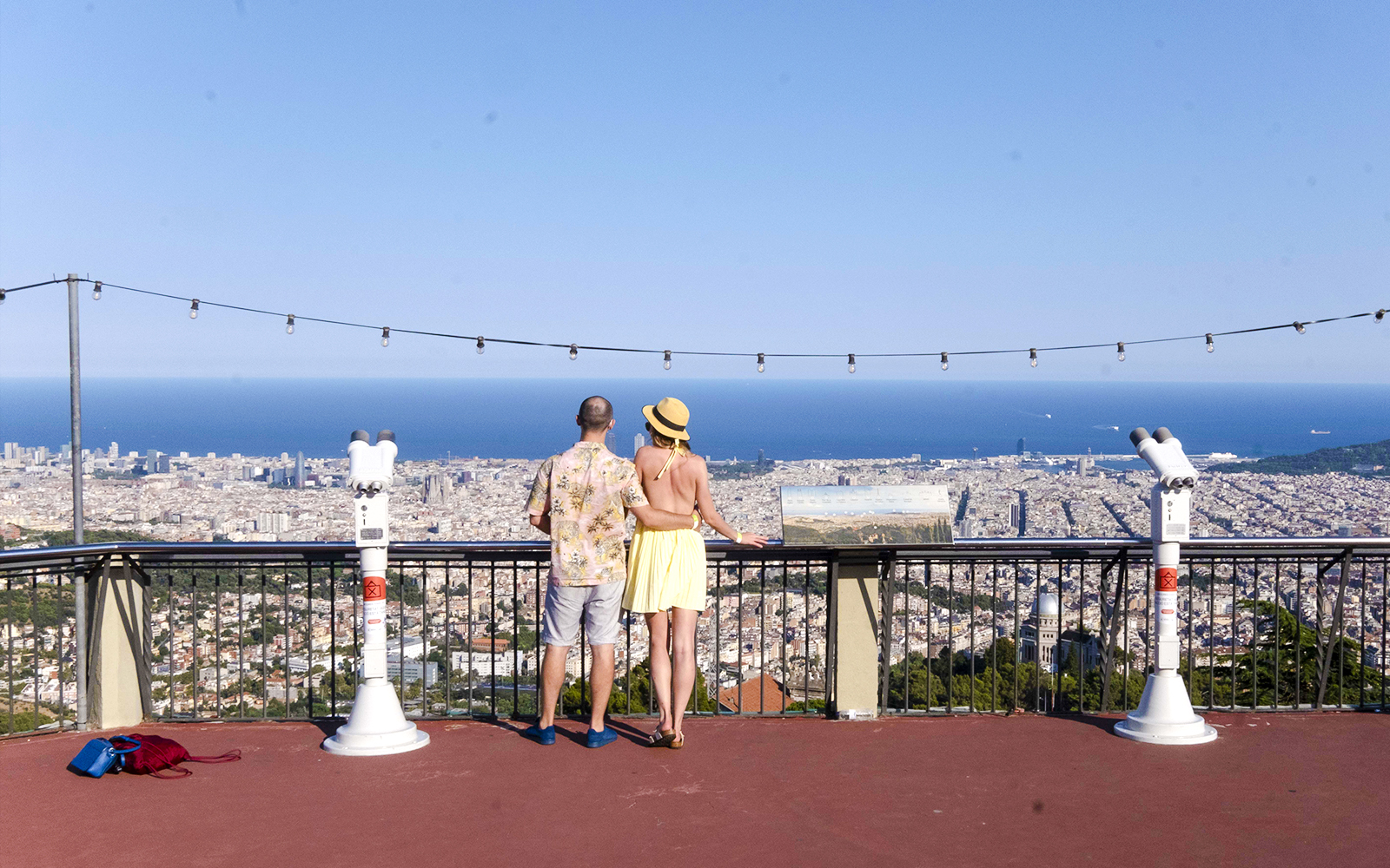 Visitors enjoying the view of Barcelona from Tibidabo Amusement Park.