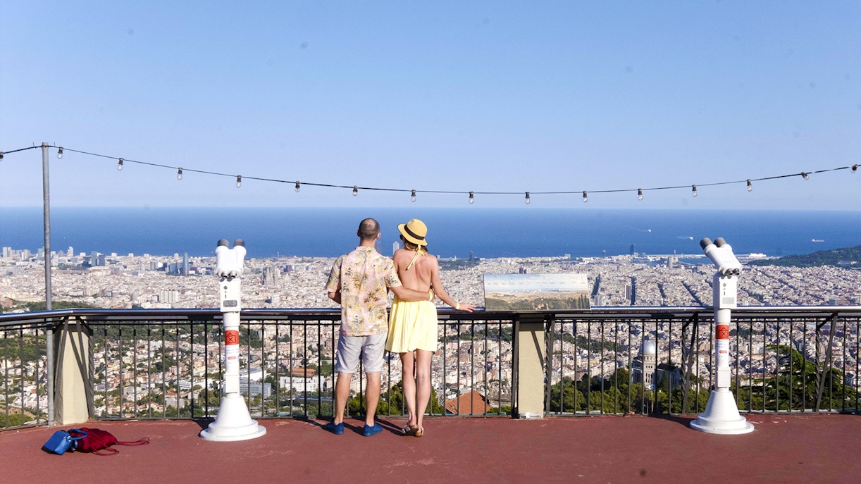 Visitors enjoying the view of Barcelona from Tibidabo Amusement Park.