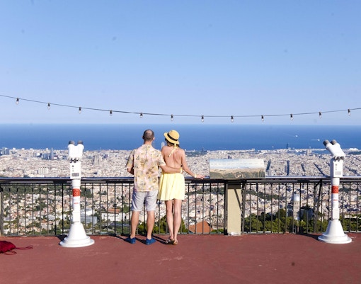 Visitors enjoying the view of Barcelona from Tibidabo Amusement Park.