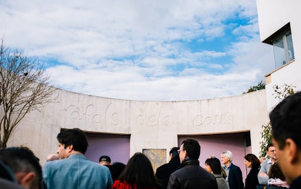 Visitors at a winery entrance in Barcelona for a wine and sparkling wine tour.