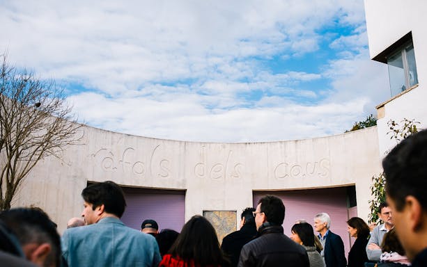 Visitors at a winery entrance in Barcelona for a wine and sparkling wine tour.