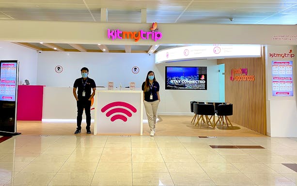 4G Pocket WiFi rental counter at Dubai airport with staff ready to assist.