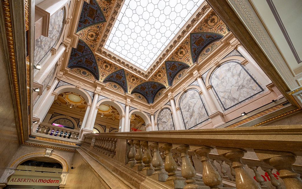 Interior staircase and ornate ceiling of ALBERTINA MODERN Vienna.
