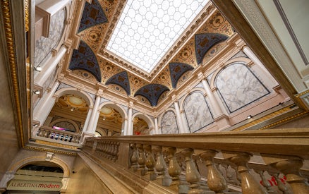 Interior staircase and ornate ceiling of ALBERTINA MODERN Vienna.