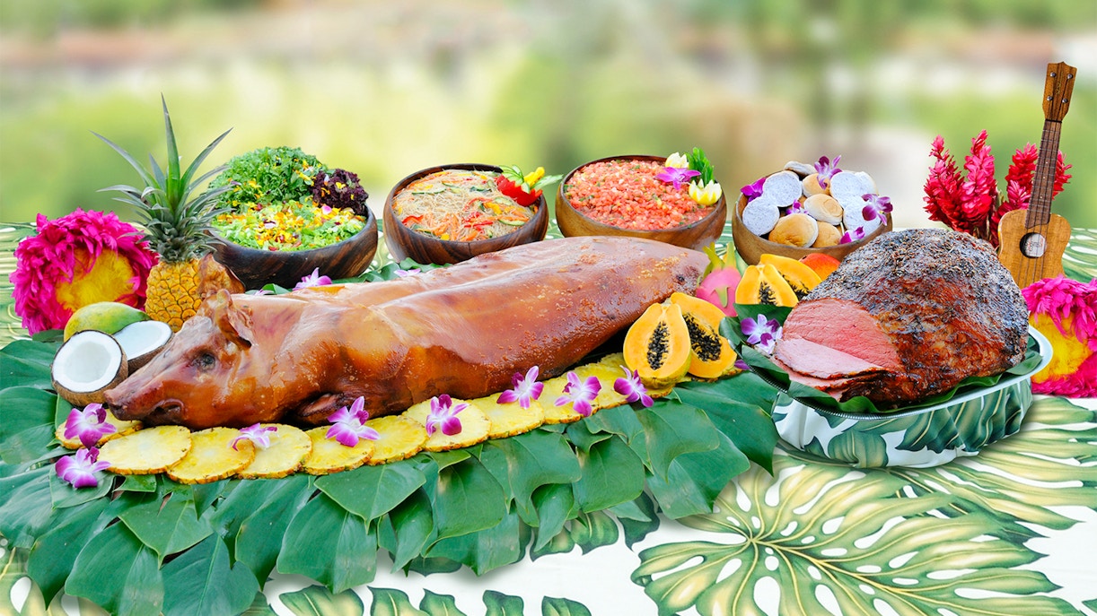 Waikiki Luau buffet with roast pig, tropical fruits, and salads at Rock-A-Hula Show.