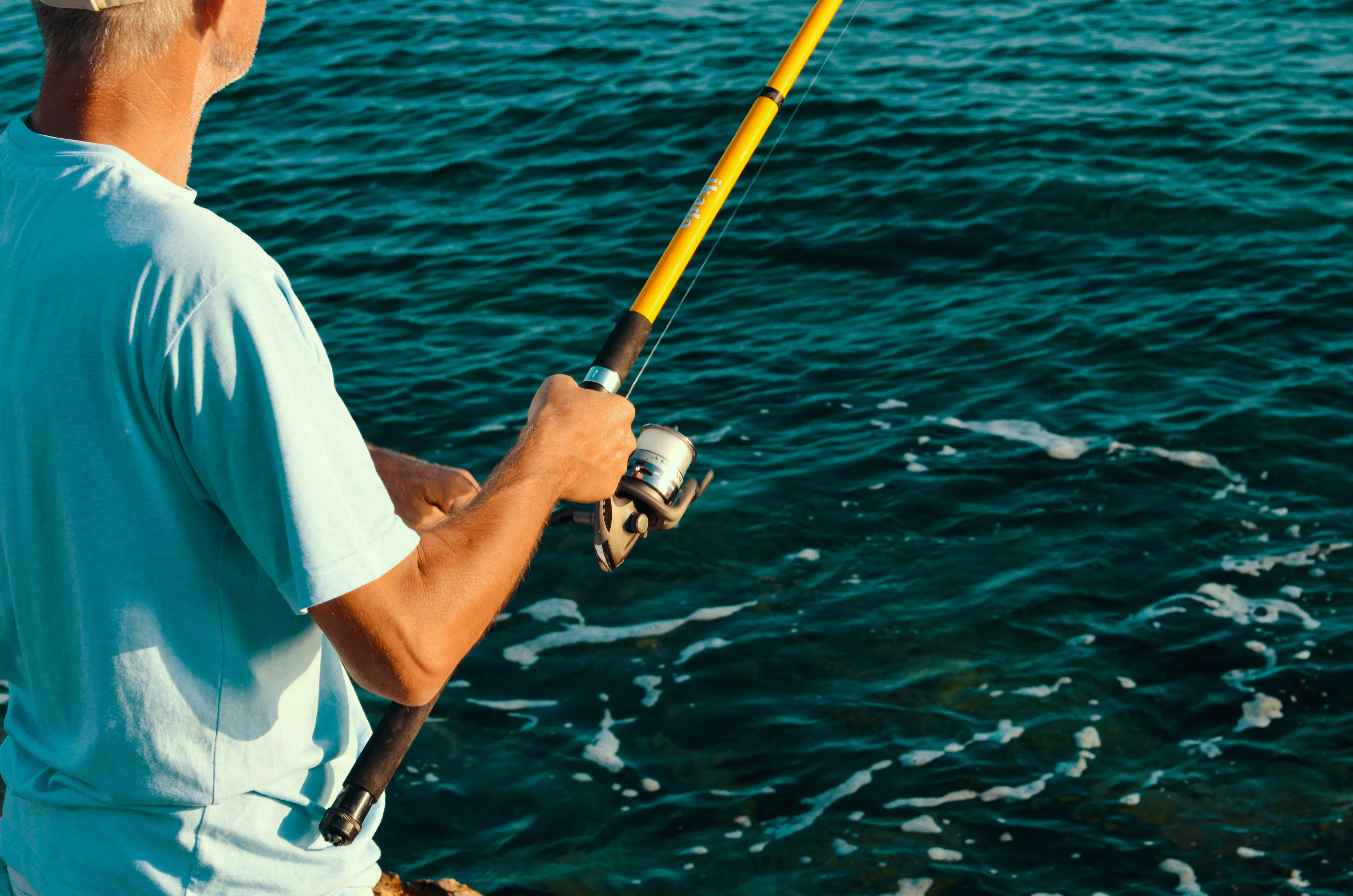 Person fishing in the ocean during a local fishing adventure in Zanzibar.