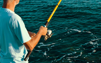 Person fishing in the ocean during a local fishing adventure in Zanzibar.
