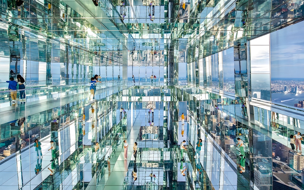 Visitors exploring mirrored observation deck at SUMMIT One Vanderbilt, New York City.