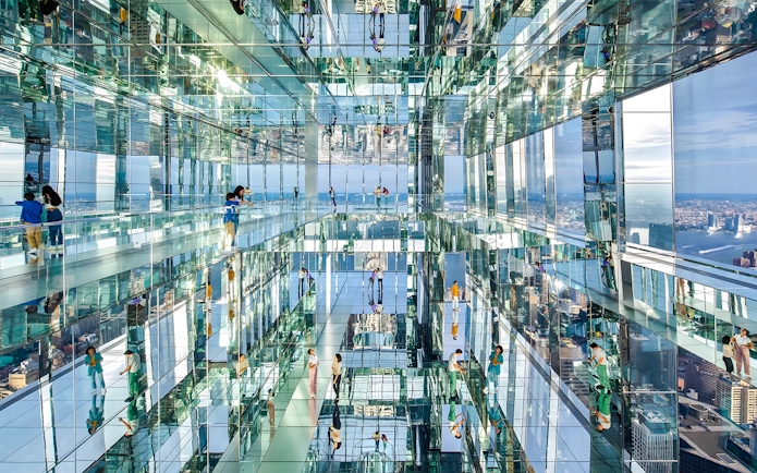 Visitors exploring mirrored observation deck at SUMMIT One Vanderbilt, New York City.