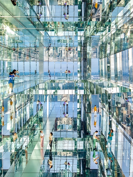 Visitors exploring mirrored observation deck at SUMMIT One Vanderbilt, New York City.