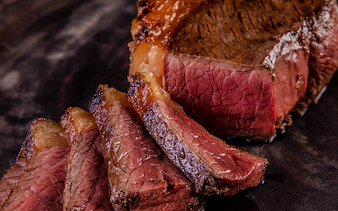 Sliced grilled meat at a Brazilian steakhouse in Rio de Janeiro.