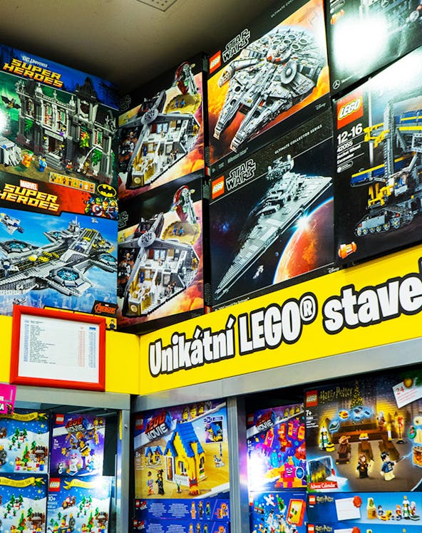 LEGO sets display at LEGO Museum Prague featuring Star Wars and Super Heroes themes.
