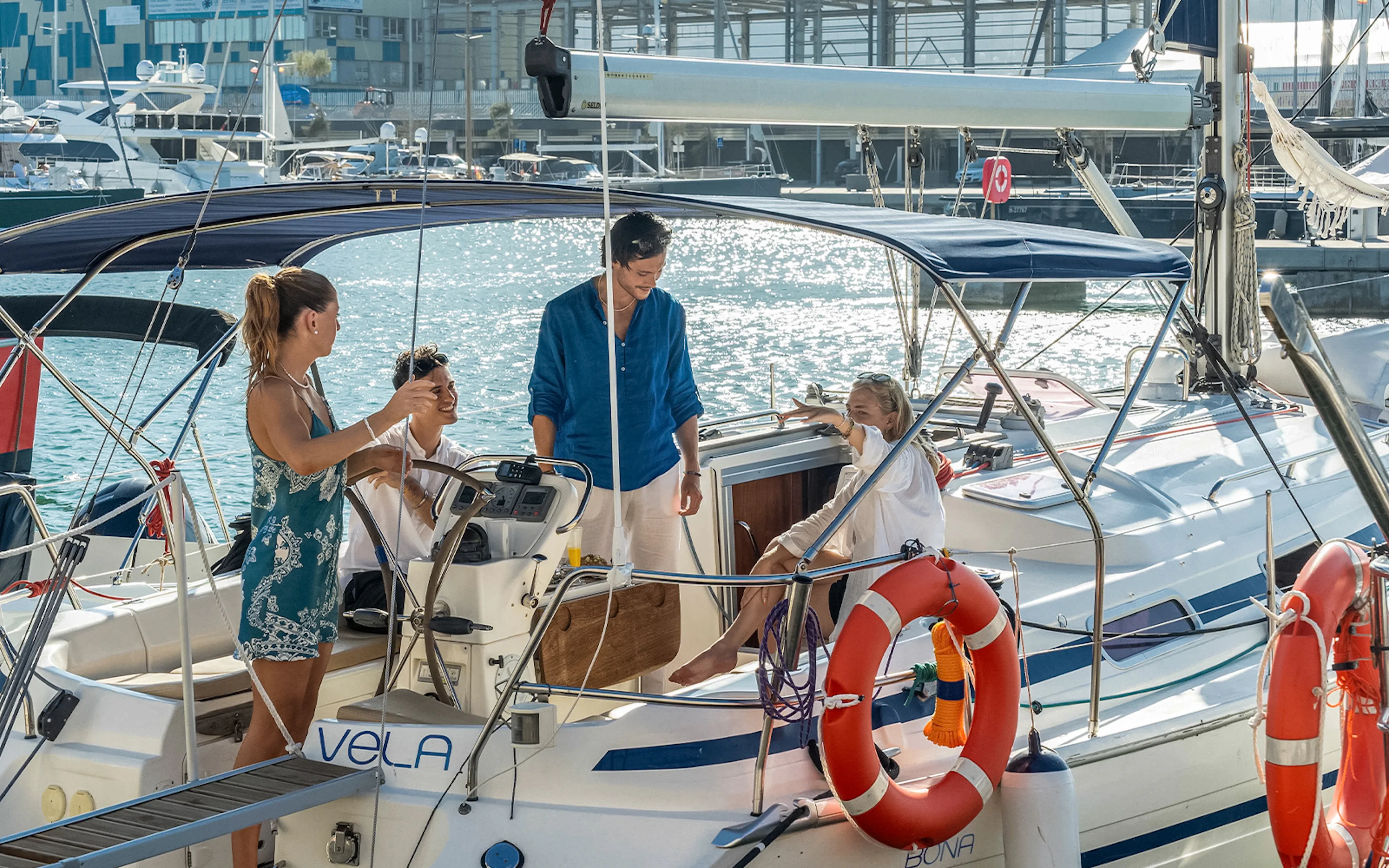 Group enjoying a sailing trip with a local captain on a sunny day.