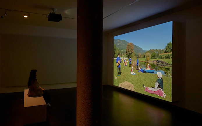 Visitor viewing Ragnar Kjartansson's "Mercy" exhibition video at National Gallery of Victoria.
