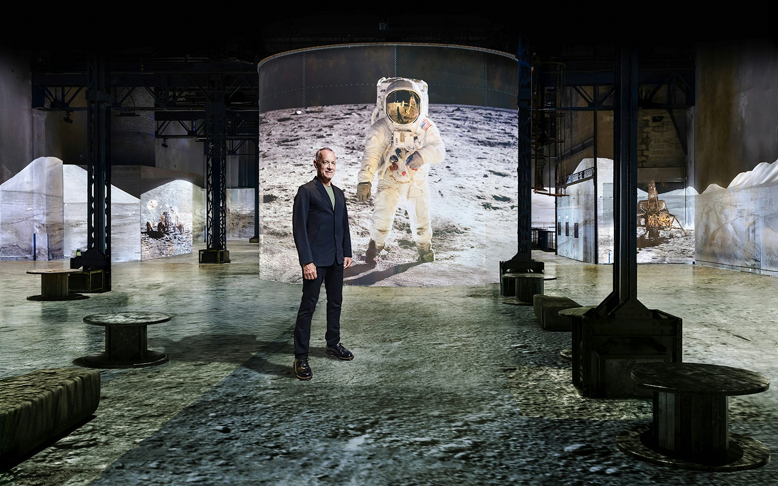 Moonwalkers Exhibition at Atelier des Lumières featuring astronaut projection.