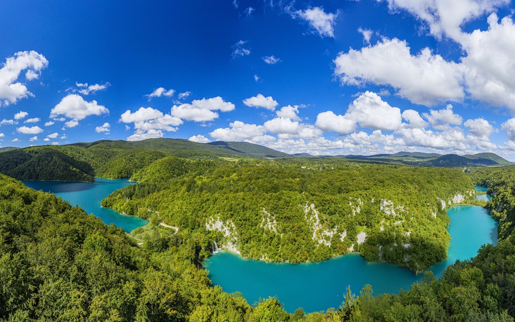 Aerial view of Plitvice Lakes National Park's turquoise lakes and lush forests in Croatia.