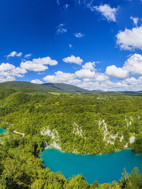 Aerial view of Plitvice Lakes National Park's turquoise lakes and lush forests in Croatia.