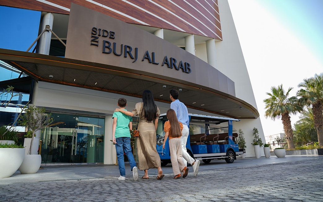Tourists entering Burj Al Arab for a luxury tour in Dubai.