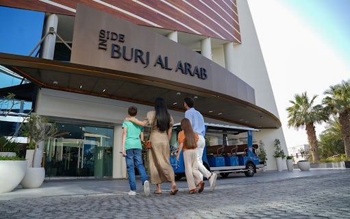 Tourists entering Burj Al Arab for a luxury tour in Dubai.