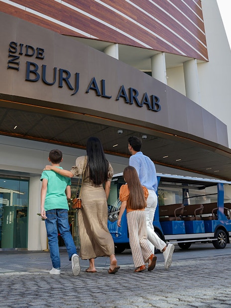 Tourists entering Burj Al Arab for a luxury tour in Dubai.