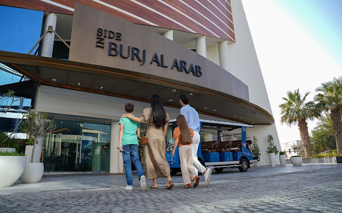Tourists entering Burj Al Arab for a luxury tour in Dubai.