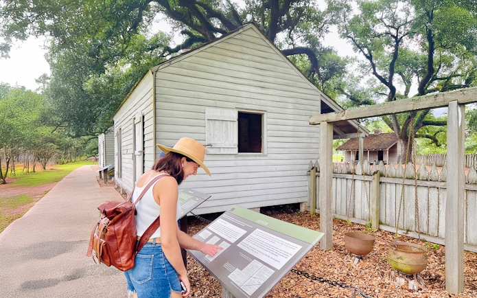 Visitor reading information at Oak Alley Plantation, Louisiana.