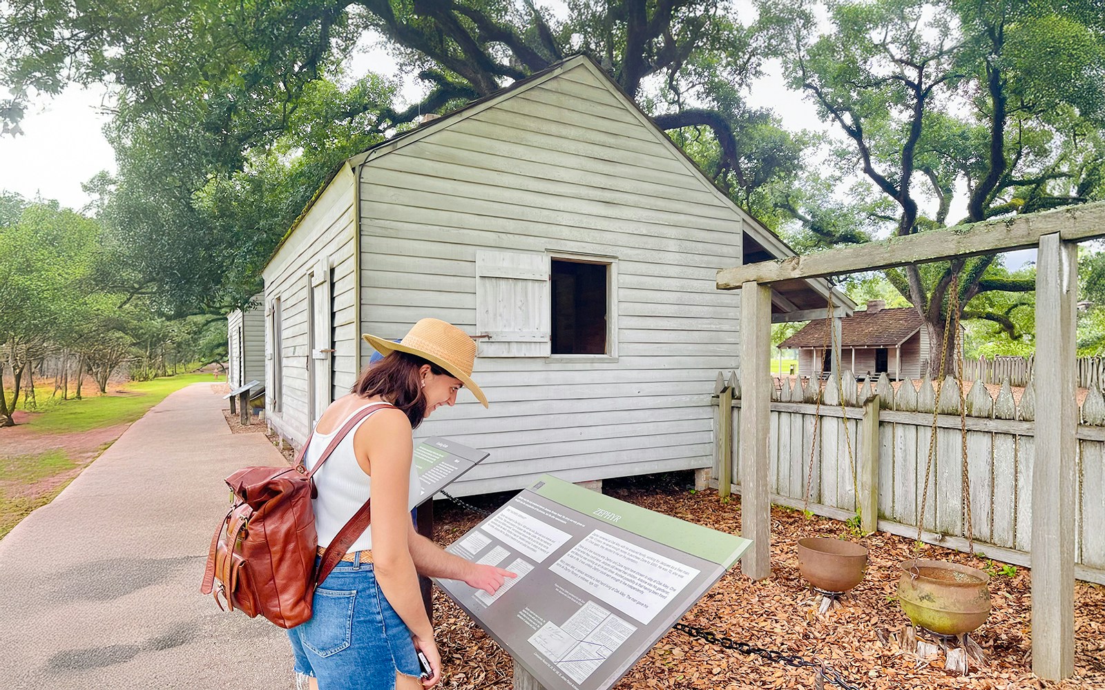 Visitor reading information at Oak Alley Plantation, Louisiana.