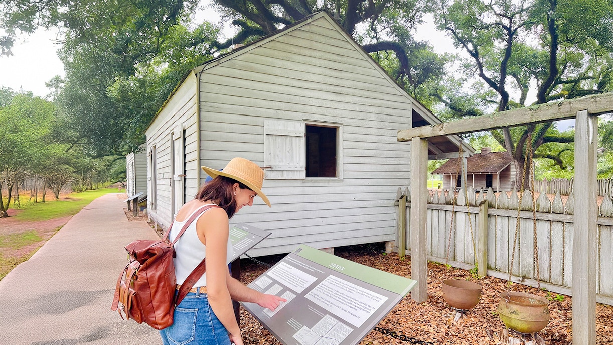 Visitor reading information at Oak Alley Plantation, Louisiana.