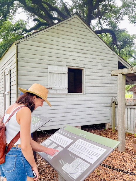 Visitor reading information at Oak Alley Plantation, Louisiana.