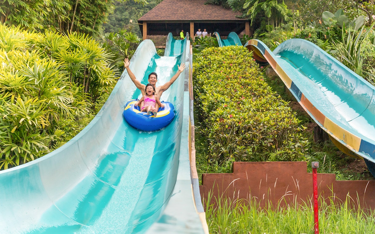 Visitors enjoying a water slide at Sunway Lost World of Tambun, Malaysia.
