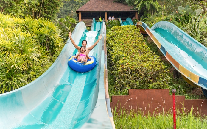 Visitors enjoying a water slide at Sunway Lost World of Tambun, Malaysia.