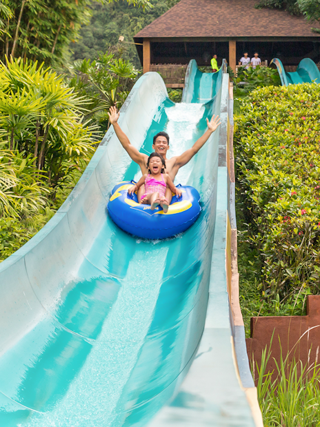 Visitors enjoying a water slide at Sunway Lost World of Tambun, Malaysia.