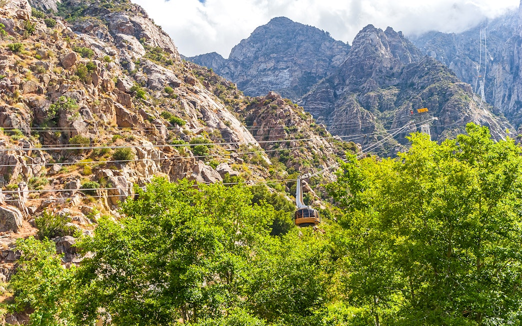 Tramway ascending rocky mountains at Palm Springs Aerial Tramway.